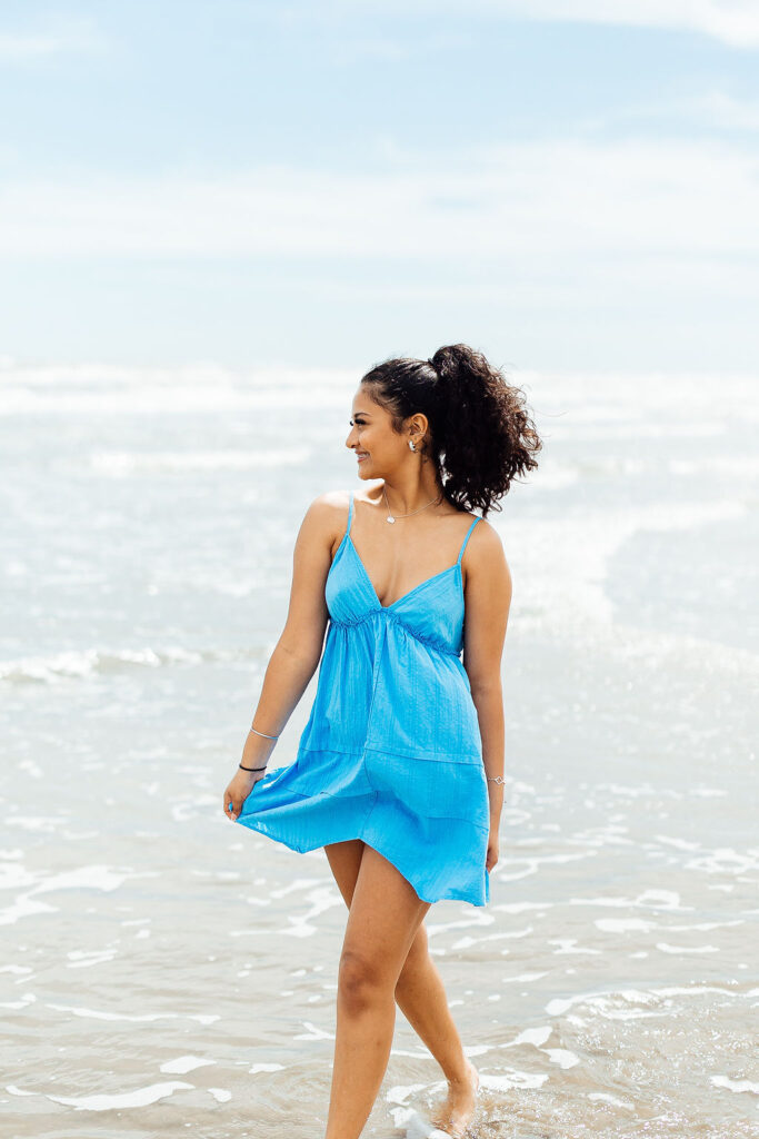 photos of senior girl during her photo session at the beach