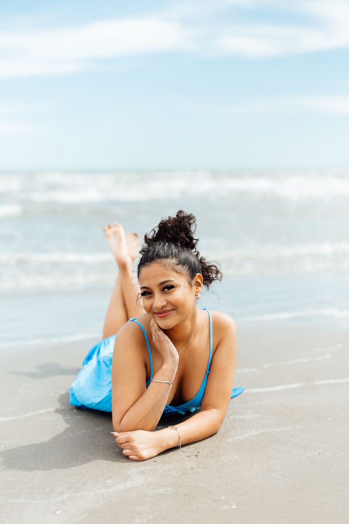 photos of senior girl during her photo session at the ocean