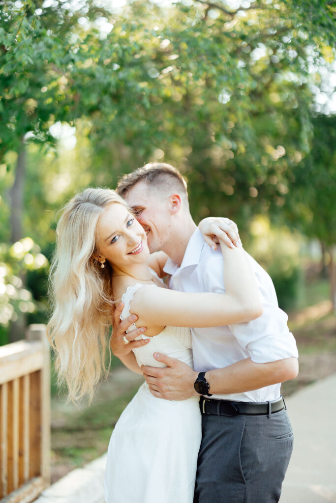 fiance kissing his fiance on the cheek