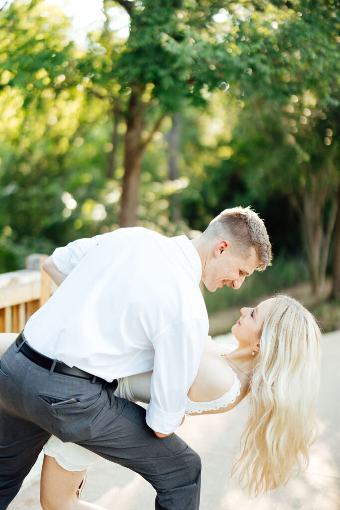 newly engaged couple looking at each other 