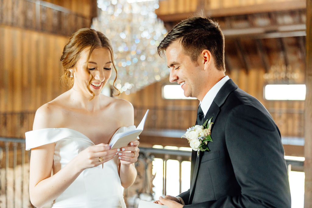 bride and groom smiling to each other