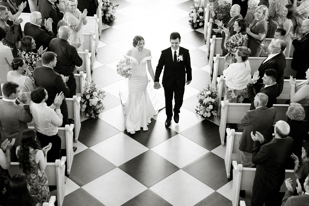 bride and groom heading to their Colorful and Fun Wedding reception