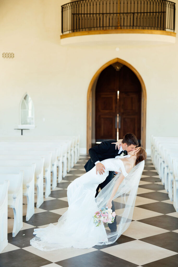 bride and groom kissing at their Colorful and Fun Wedding