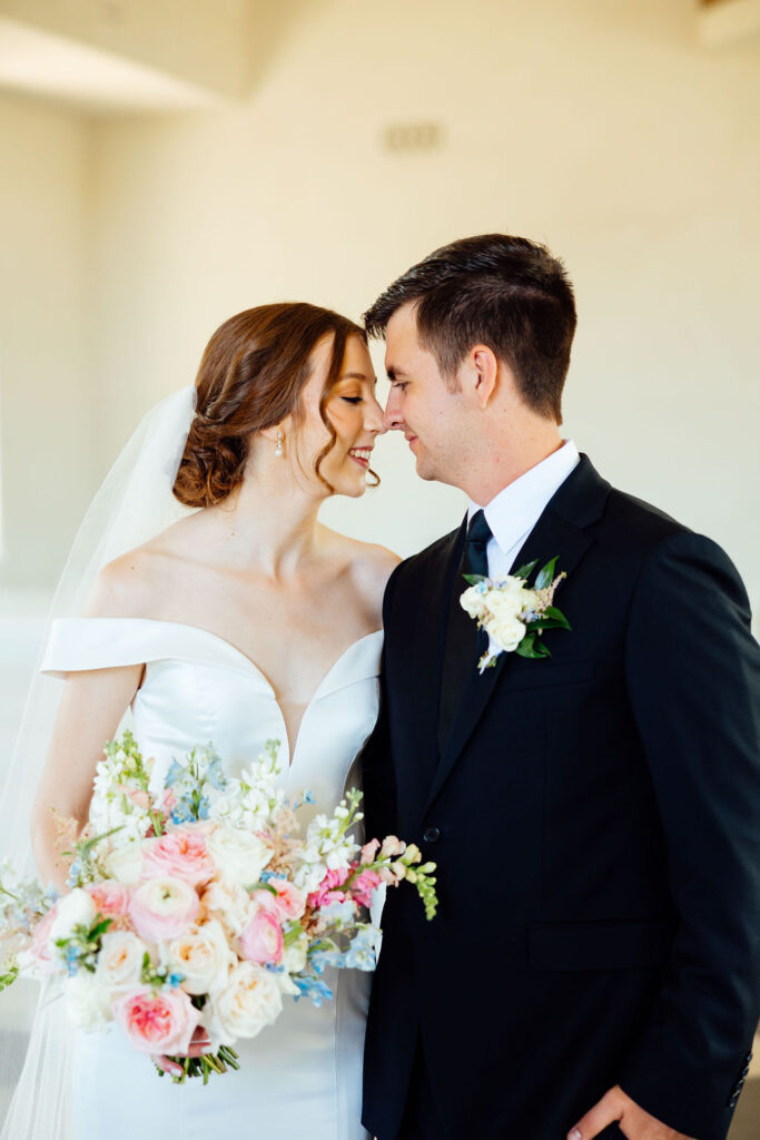 bride and groom looking at each other 