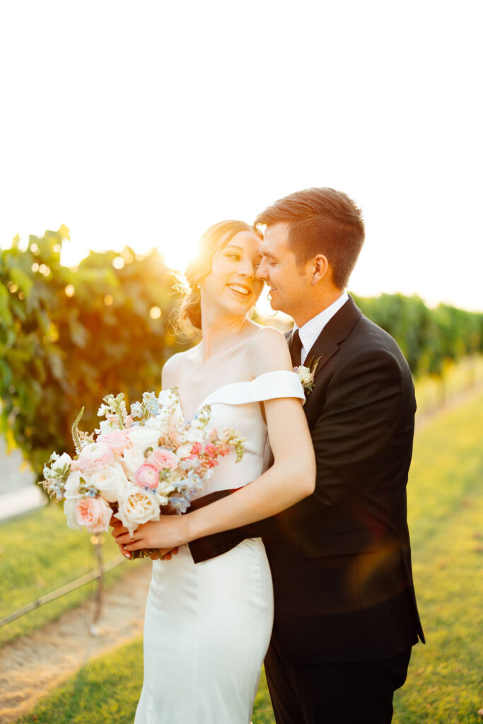 bride and groom looking at each other 