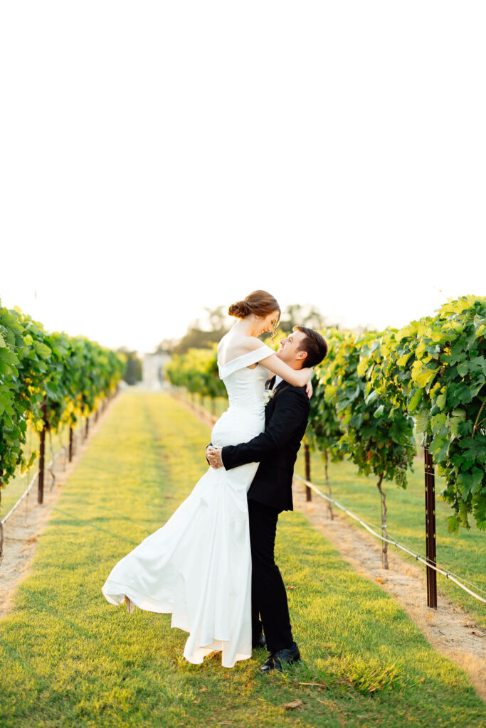 bride and groom kissing after their wedding ceremony