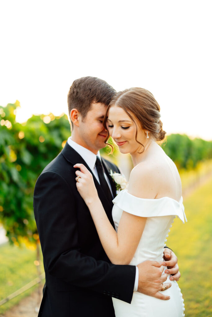 bride and groom hugging after their wedding reception