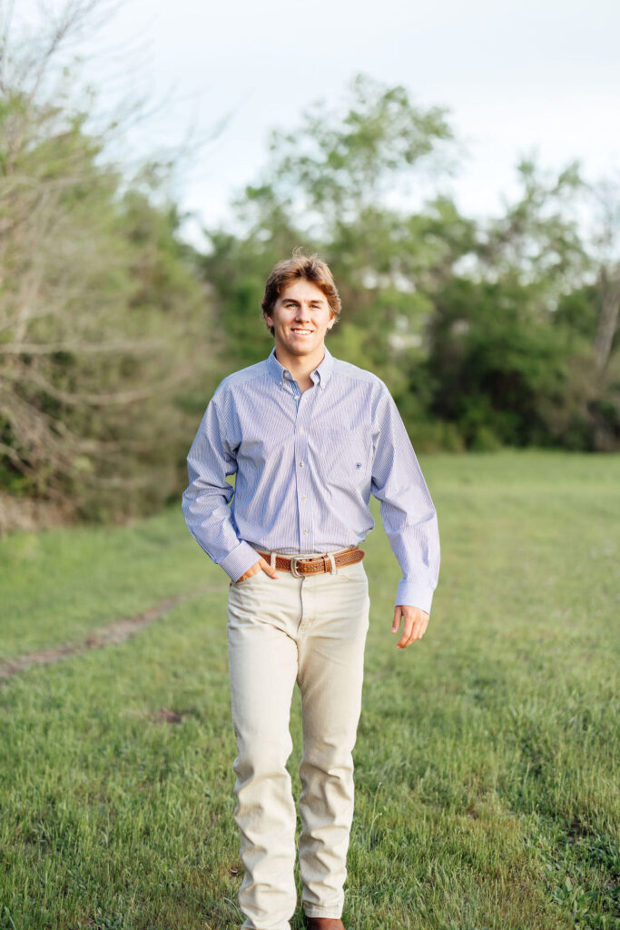 guy walking during senior photos