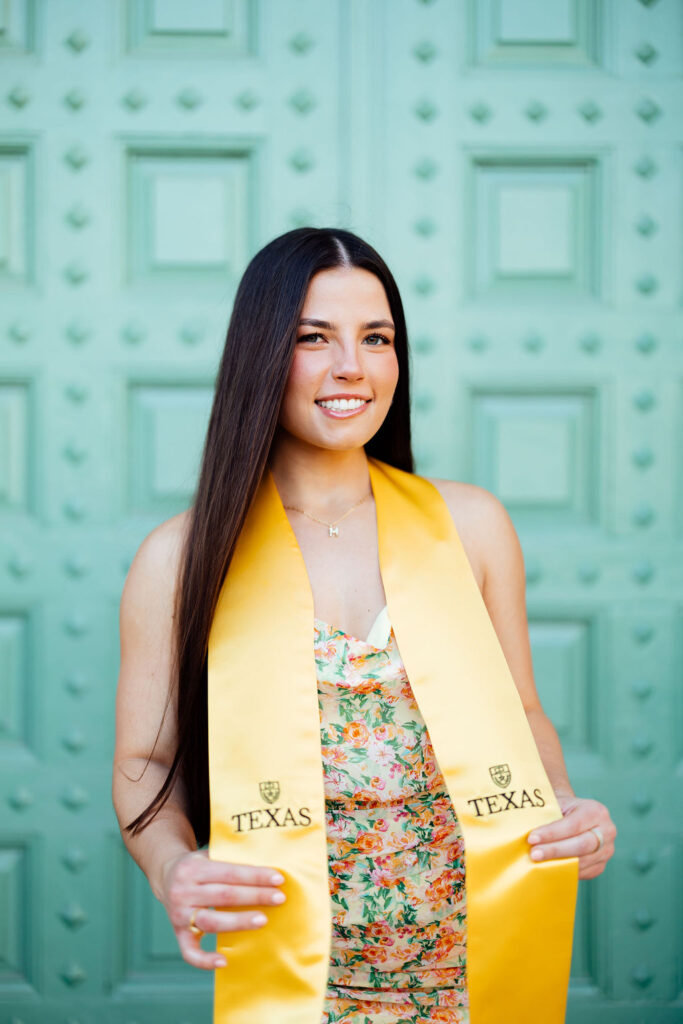 girl taking photos for college graduation 