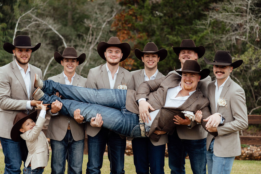 groom with groomsmen during western wedding day