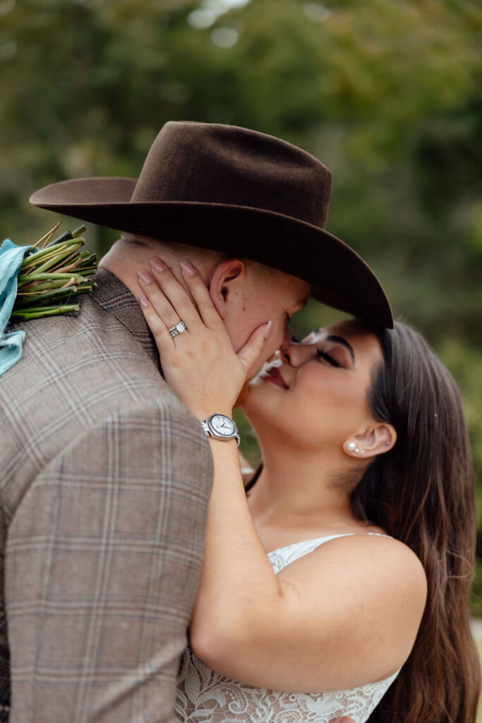 bride and groom hugging | western wedding day at peach creek ranch in college station, texas